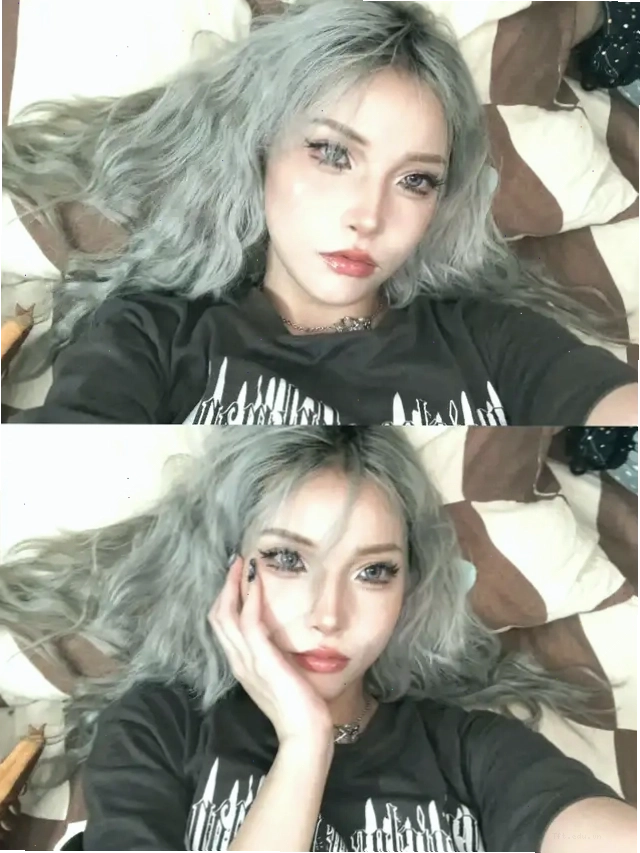 Cô gái tóc xám nằm trên giường tạo dáng selfie